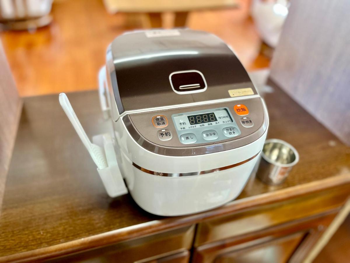バーベキューもできる! 海と浜比嘉大橋を一望できる宿 Henza Extérieur photo